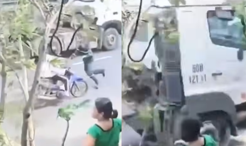 Khoảnh khắc thót tim: Chiến sĩ công an lao vào cứu nữ sinh ngay trước đầu xe container – Chỉ chậm 1 giây thôi là bi kịch đã xảy ra